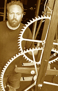 [Man with huge cogs]