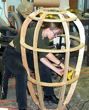 [Oval wooden cage]
