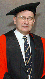 [McBoyle in red-and-black gown]