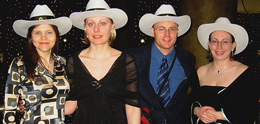 [Four in hats, two in low-cut dresses]