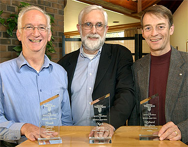 [Each with a plexiglass trophy]