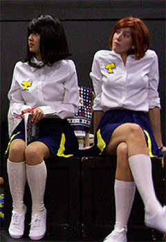 [Two cheerleaders on bench]