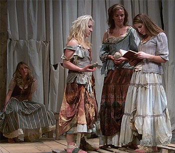 [Four women in peasant dresses]