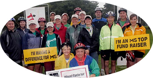 [18 team members with signs about MS fund-raising]