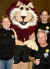 [Three people with Pounce mascot]