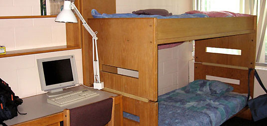 [Desk and bunk beds on one side of room]