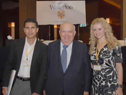 Adel Sedra, engineering dean, with Yousif Al-Khdr, 2B co-op student and Elena L’Pris, BASc ’06.