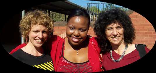 Rebecca Campbell and Carol Ann Weaver with teacher/singer Thankdeka Mazibuko at Zulu Township School, Durban, South Africa