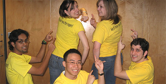 [Five volunteers in yellow T-shirts]