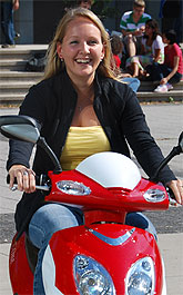 [Happy on her red bike]