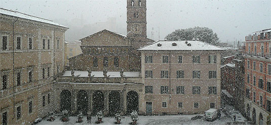 [Snowflakes in the air over Piazza Santa Maria in Trastevere]