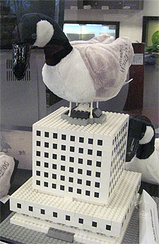 [Stuffed goose atop Lego library]