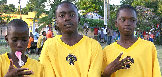 [Young athletes in yellow Warrior shirts]