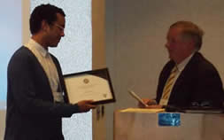 Brandan Rowe receives his Pragma Award.