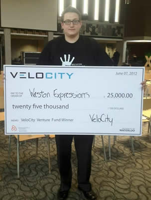 Enterprise Co-op student Douglas Lusted poses with an oversize cheque.