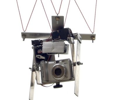 Camera rigged to hang from kite line