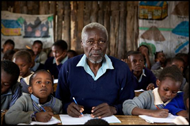 A promotion image from the movie The First Grader showing an elderly man in grade school.
