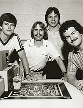 Jim Jonkman, Tom Schulz, Greg Bakker, and Jonathan Schaeffer pose with their chess chip.