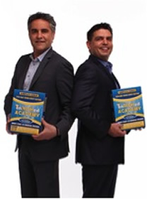 Two men hold copies of the EnRICHed Start program book.