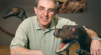 Peter Russell and a rather toothy dinosaur in the Earth Sciences Museum.