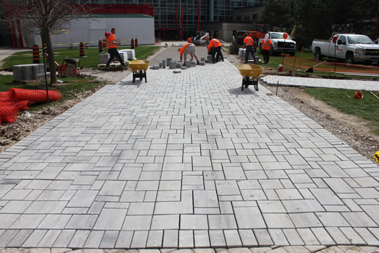 Workers put the finishing touches on the pathway.