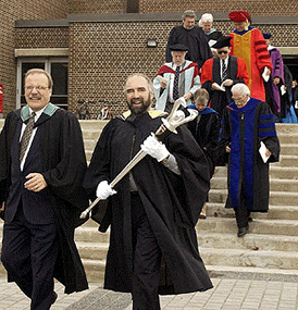 Ken Lavigne and Rick Haldenby lead the convocation procession in 2002.