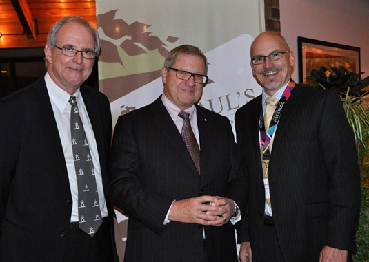 Graham Brown, (left) and Larry Swatuk (right) as they greet the Hon. Lloyd Axworthy prior to the 2012 Stanley Knowles Humanitarian Service Lecture.