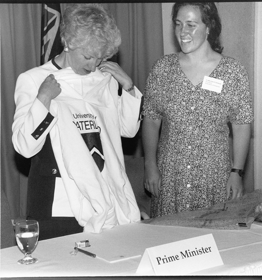 In this 1993 photo, Prime Minister Kim Campbell receives a University of Waterloo t-shirt from Catherine Coleman, Federation of Students president.