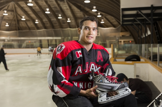 Jeffrey Azzolin shows off a Bladetech ice skate.