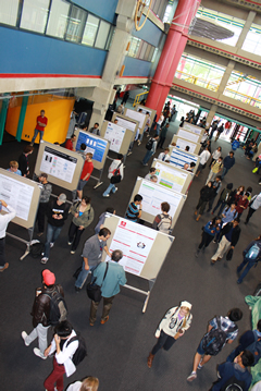 An overhead view of the research symposium.
