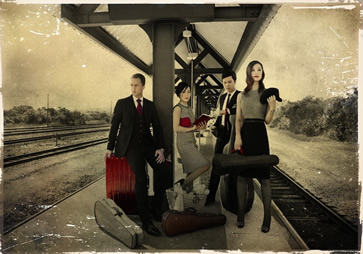 Attacca Quartet image. The quartet standing at a train station.