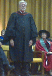Chris Redmond stands as his award citation is read at Convocation.