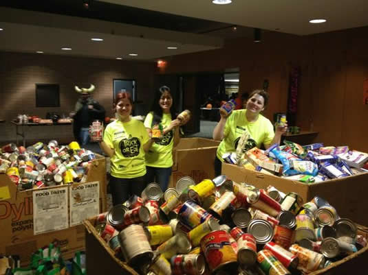 Students pose with a mighty haul of non-perishable food items.