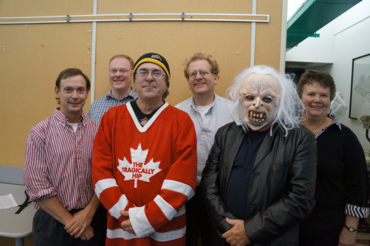 Tim Ireland, Jonathan Sutherland, Mark Spencer, Ted Harms (Captain), Charles Woods, and Jenny Williams pose for Movember.