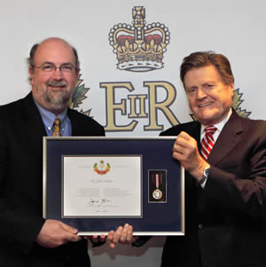 John Hirdes receives a Queen's Diamond Jubilee Medal.