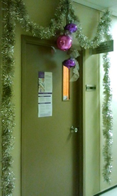 An office door decorated for Christmas.