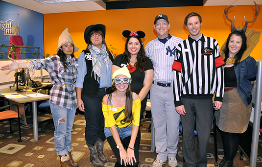 Staff from Housing and Residences in Halloween costumes.