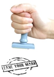 "Make your mark," poster with a hand using a stamp.